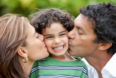 Parents Kissing Kid